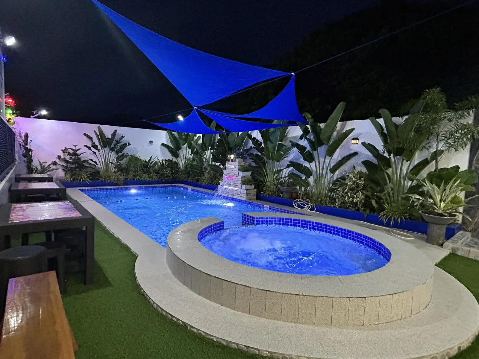 Private pool, jacuzzi and waterfall at night at T.A. Faytaren in Batangas City