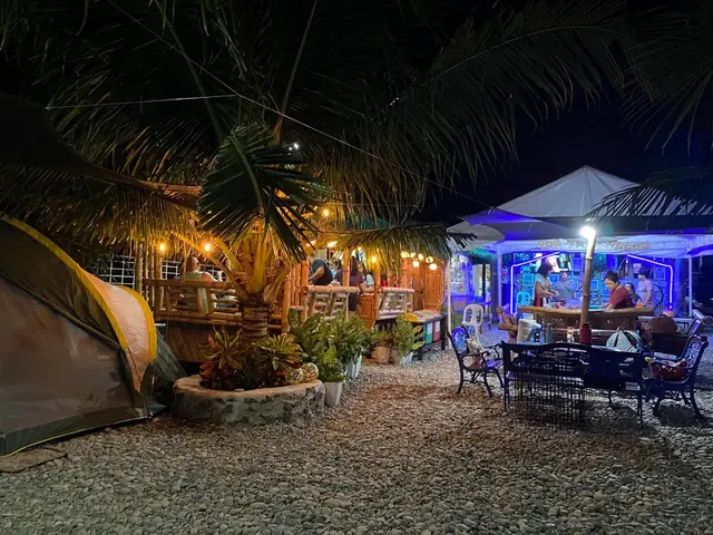 A guest tent under string lights