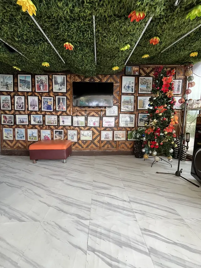 Common area with a photo wall, TV and videoke