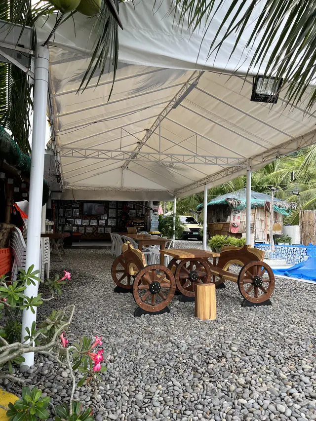 Covered dining tent with wooden cart tables