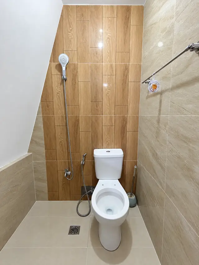 Family room bathroom with toilet and shower
