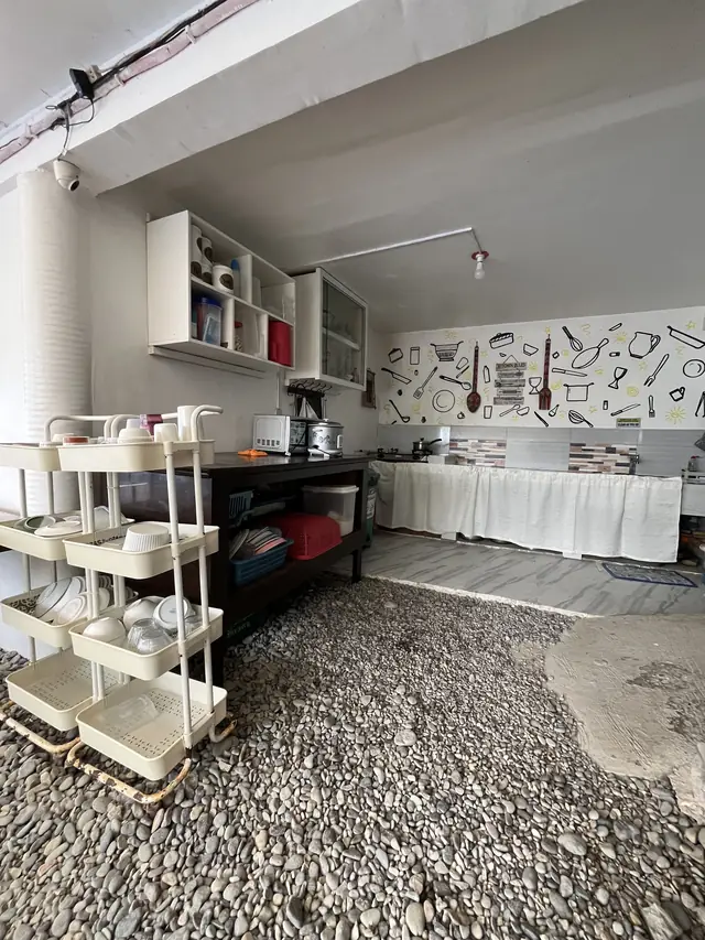 Kitchen area with dish racks and counters