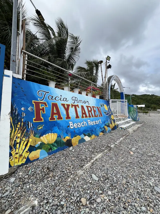 Tacia Amor Faytaren Beach Resort painted sign by the shore